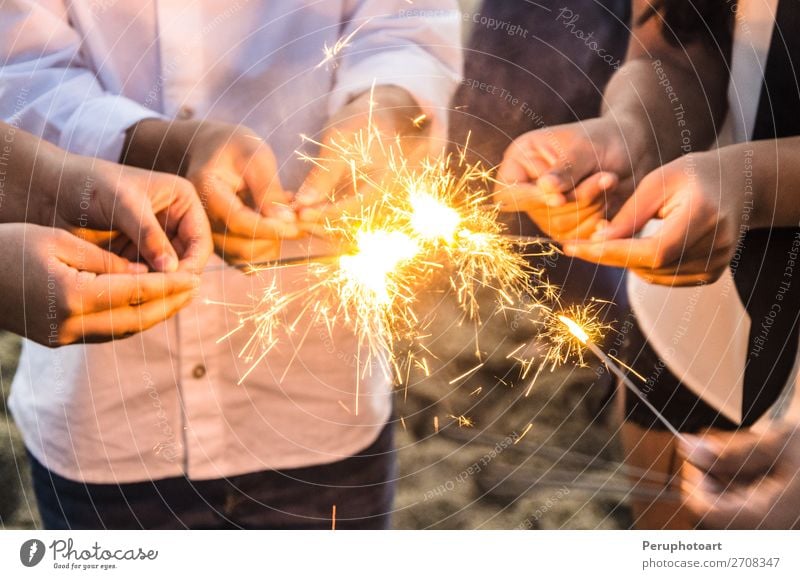 Beautiful sparklers in people hands, xmas and new year concept. Joy Happy Winter Decoration Feasts & Celebrations Christmas & Advent New Year's Eve Birthday