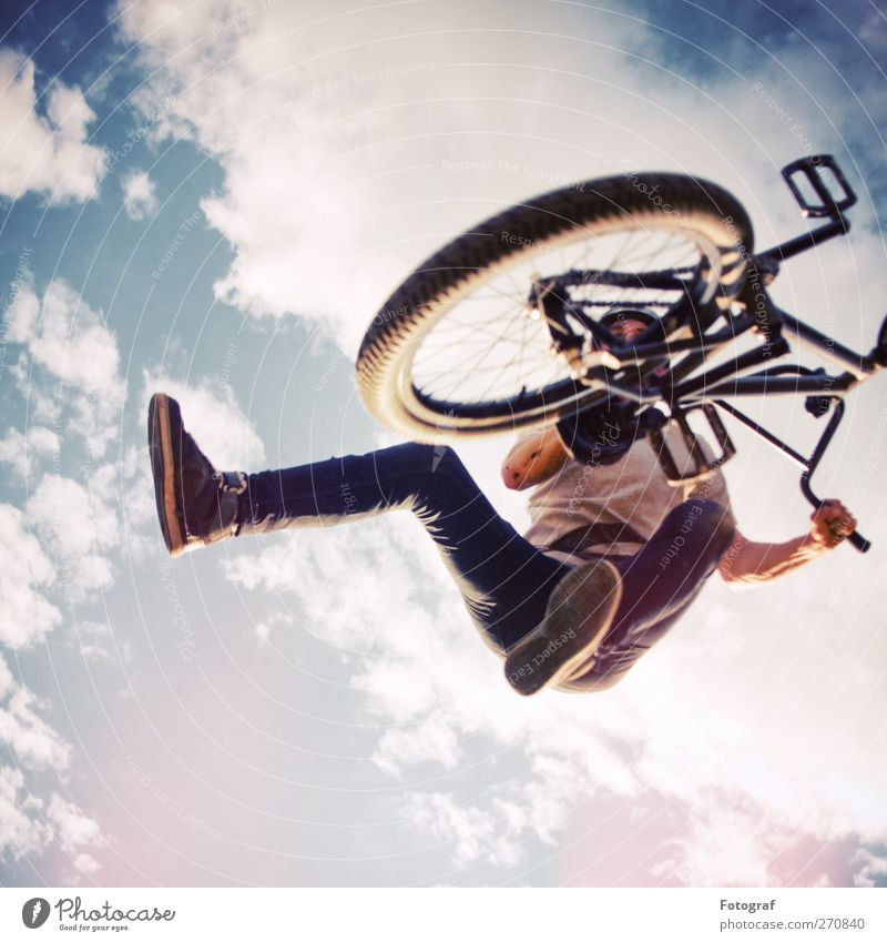 BMX Tailwhip Sports Cycling Bicycle Human being Young man Youth (Young adults) 1 18 - 30 years Adults Youth culture Sky Clouds T-shirt Jeans Sneakers Jump