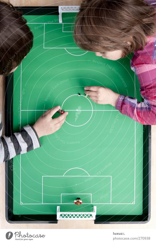 kicked off Playing 2012 Bird's-eye view Table soccer Child Striped Center circle Colour photo