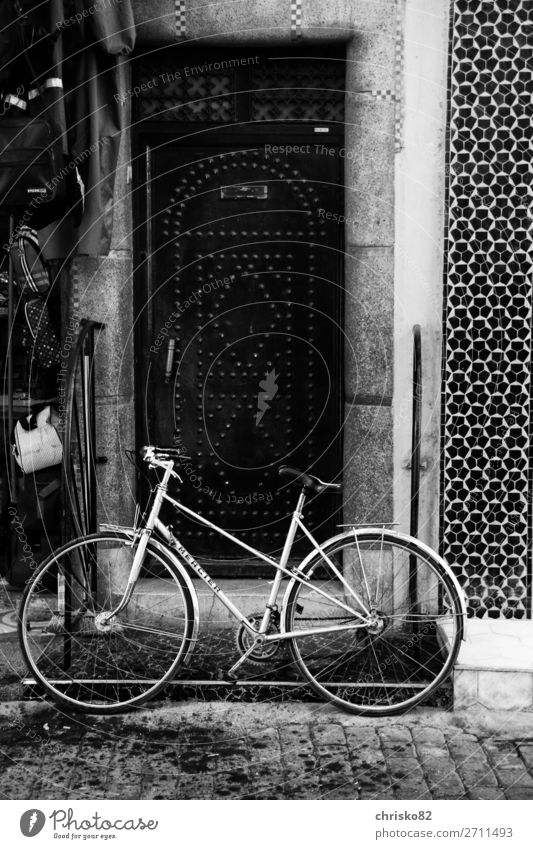 bikes Elegant Style Bicycle Town Old town Pedestrian precinct Door Means of transport Cycling Movement Driving Fitness Stand Esthetic Authentic Simple