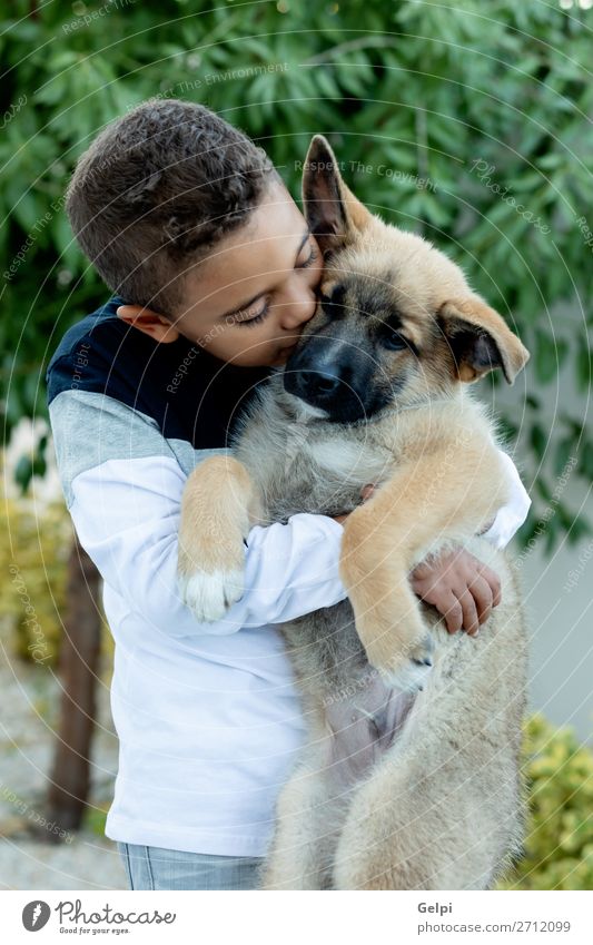 Latin child with his dog Lifestyle Joy Happy Face Relaxation Leisure and hobbies Child Human being Boy (child) Man Adults Family & Relations Friendship Infancy