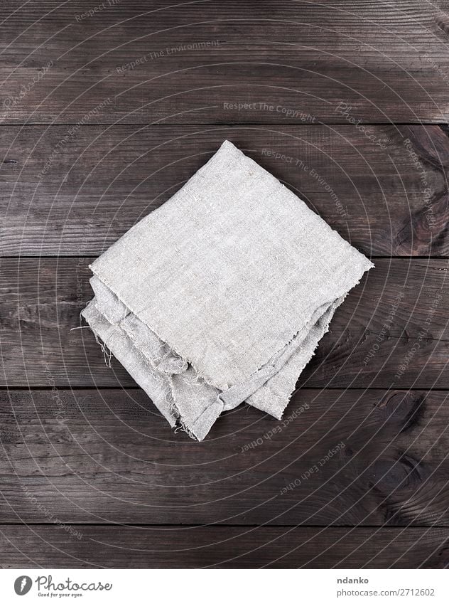 Close up beige table cloth fabric texture wallpaper background A flat lay  view of a casually wrinkled rustic beige kitchen cloth towel with as a  background image. Stock Photo
