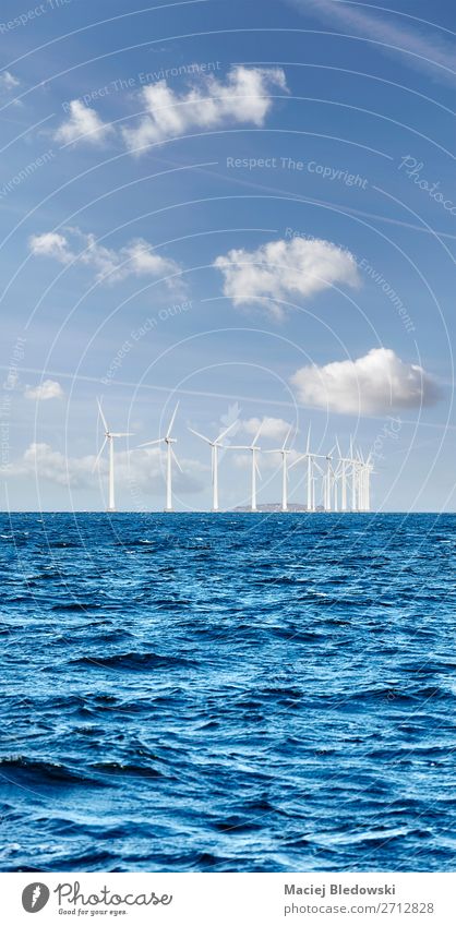 Offshore windmill farm on a sunny day Ocean Industry Energy industry Renewable energy Wind energy plant Environment Nature Sky Clouds Horizon North Sea