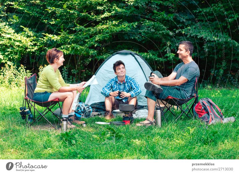 Spending a vacation on camping Lifestyle Relaxation Vacation & Travel Tourism Adventure Camping Woman Adults Man 3 Human being Group 30 - 45 years Nature Sit