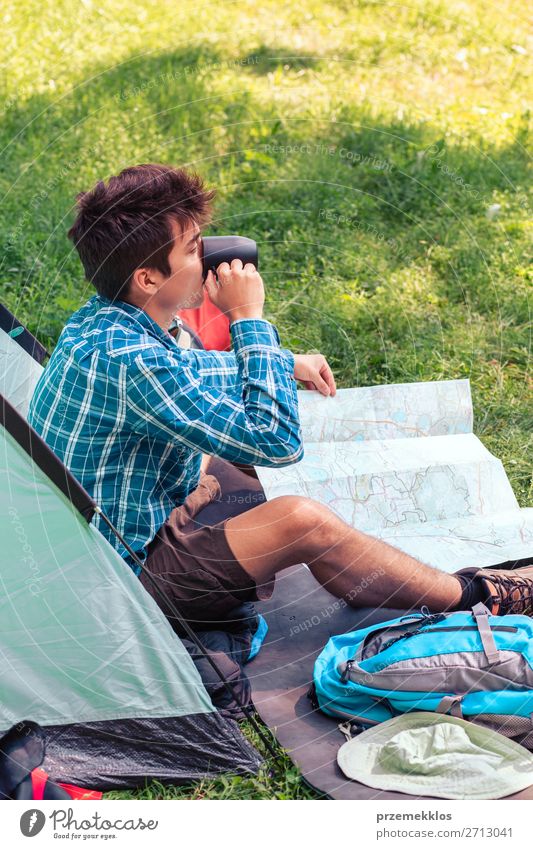 Spending a vacation on camping Drinking Lifestyle Relaxation Vacation & Travel Tourism Adventure Camping Young man Youth (Young adults) Man Adults 1 Human being