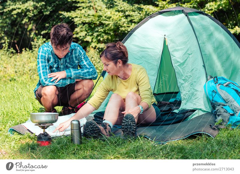 Spending a vacation on camping Lifestyle Relaxation Vacation & Travel Tourism Trip Adventure Camping Summer vacation Woman Adults Man 2 Human being Nature Sit