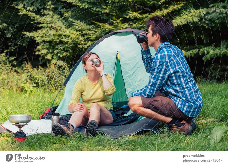 Spending a vacation on camping Lifestyle Relaxation Vacation & Travel Tourism Adventure Camping Young man Youth (Young adults) Woman Adults Man 2 Human being