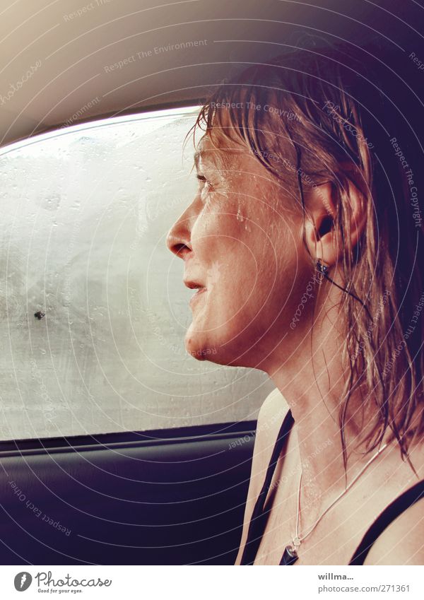 Woman sitting in car, wet from rain, laughing Wet rainwater Rain Rainy weather Happiness Car Window Smiling Laughter Experience Joie de vivre (Vitality) Joy