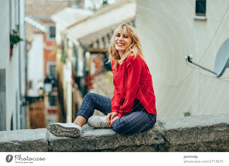 Blonde girl with red shirt enjoying life outdoors. - a Royalty Free Stock  Photo from Photocase