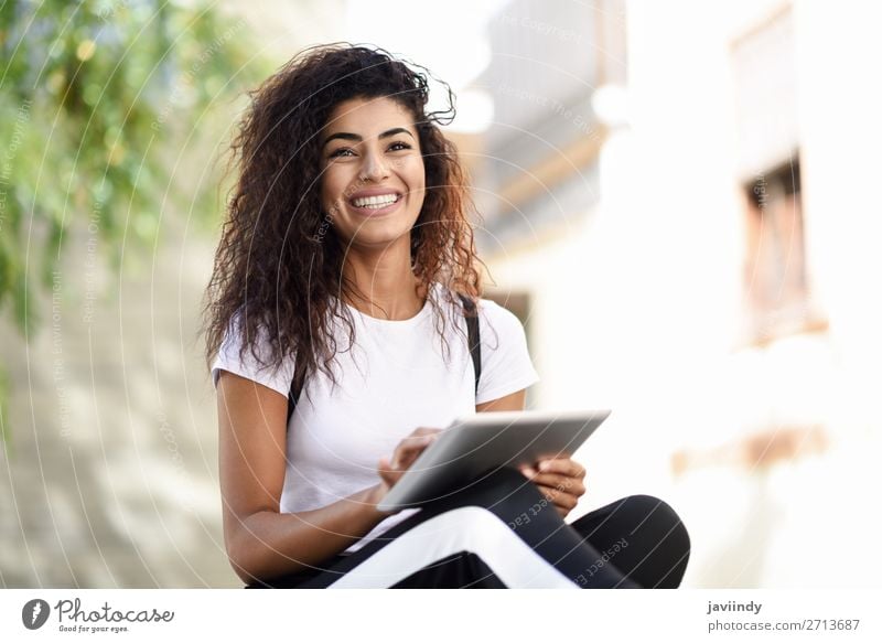 Smiling African woman using digital tablet outdoors Lifestyle Style Happy Beautiful Hair and hairstyles Tourism Technology Internet Human being Feminine
