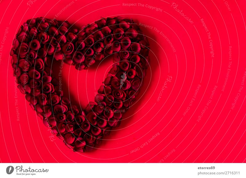 Heart made of red roses on red background for Valentine's Day. Love Mother's Day Rose Flower Symbols and metaphors Feasts & Celebrations Vacation & Travel