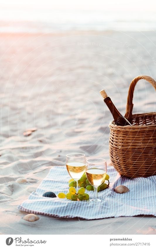 Two wine glasses, grapes, wicker basket on beach Fruit Picnic Beverage Alcoholic drinks Wine Champagne Bottle Champagne glass Lifestyle Beautiful Relaxation