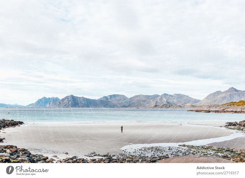 Anonymous person standing on ocean Waves Coast Lake Water Hill Mountain Peak Nature Vacation & Travel Vantage point Picturesque Slagheap Landscape Height Rock