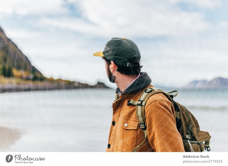 Tourist man at lake Man Lake Mountain Hill Backpack hiker trekking Water Human being Peak Nature Vacation & Travel Vantage point Picturesque Slagheap Landscape