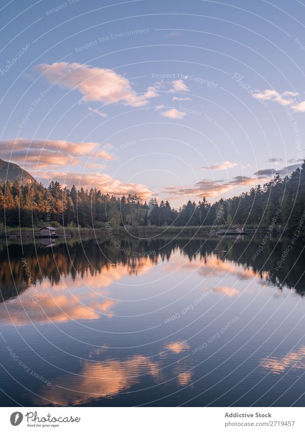 Mirror surface of lake in mountains in Dolomites, Italy Mountain Lake Serene Calm Water Building Landscape Dock Reflection residential