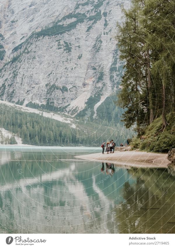 Group of people on lake in mountains Human being Lake Mountain Tourism Adventure Landscape Sports Action Nature Exterior shot Panorama (Format) Trip Wilderness