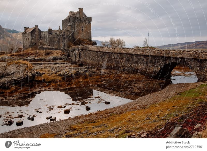 Historic castle at lake Castle Old Coast Rock Lake Hill Mountain Landscape Nature Water Natural mansion big Stone Beautiful Clouds Scotland Grass