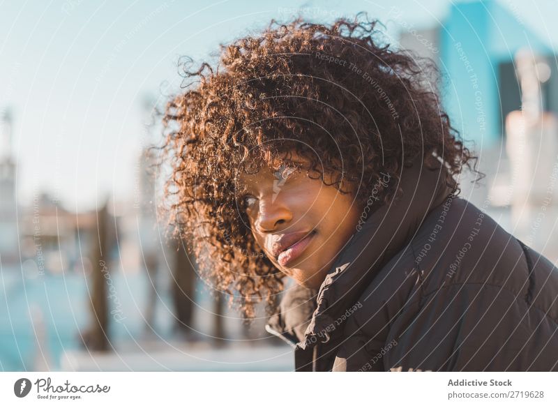 Stylish woman sitting on fence Woman Ethnic pretty Beautiful Youth (Young adults) City Park Sit Fence Style Easygoing Cool (slang) Portrait photograph