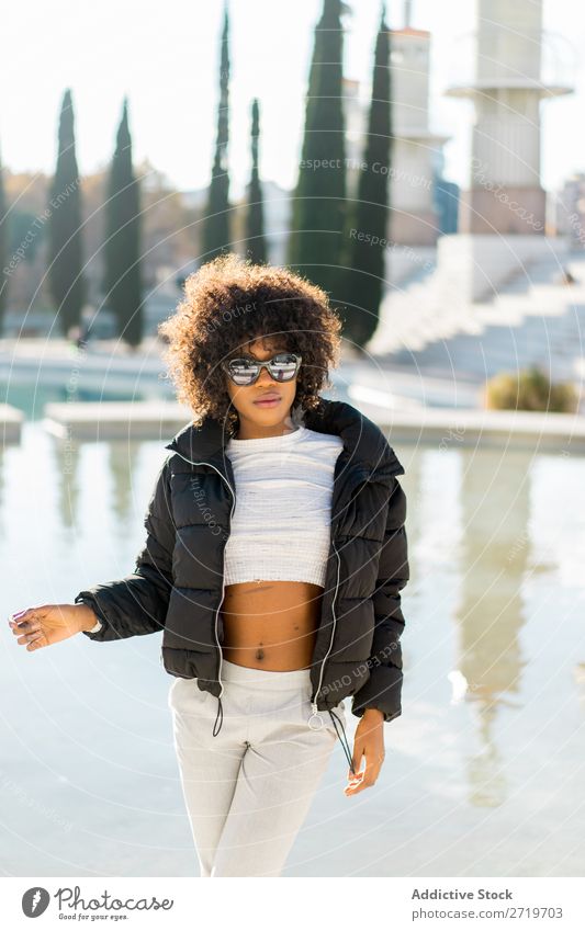 Stylish woman at city pond Woman Ethnic pretty Beautiful Youth (Young adults) Sunglasses Pond Park Cool (slang) City Town Style Portrait photograph Human being
