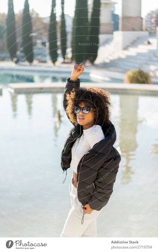Stylish woman at city pond Woman Ethnic pretty Beautiful Youth (Young adults) Sunglasses hand up Pond Park Cool (slang) City Town Style Portrait photograph