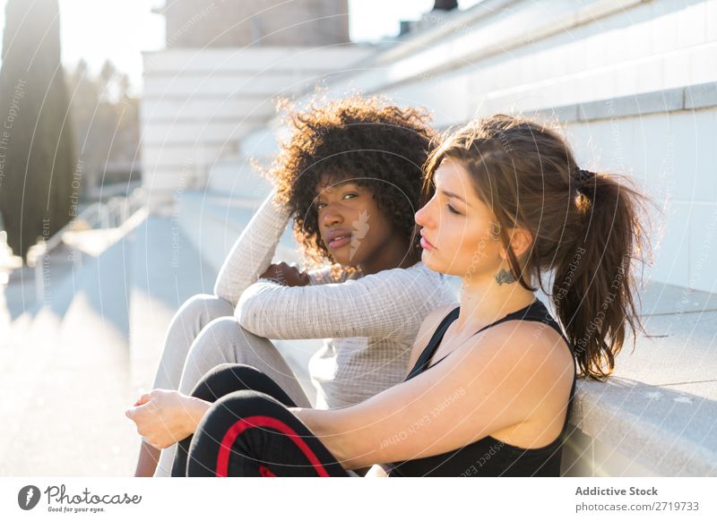 Happy friends sitting on steps Woman pretty Beautiful Youth (Young adults) Sit Steps Looking into the camera Cool (slang) City Town Style Portrait photograph