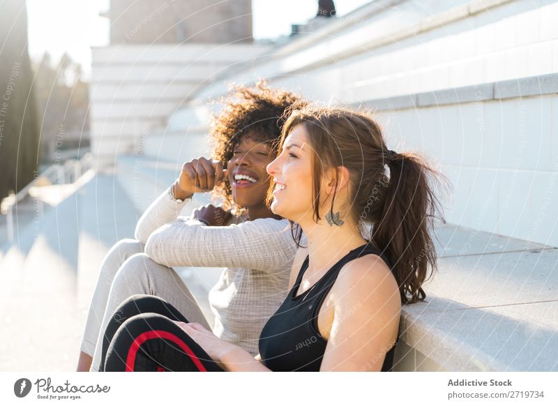Happy friends sitting on steps Woman pretty Beautiful Youth (Young adults) Sit Steps Cool (slang) City Town Style Portrait photograph Human being Attractive