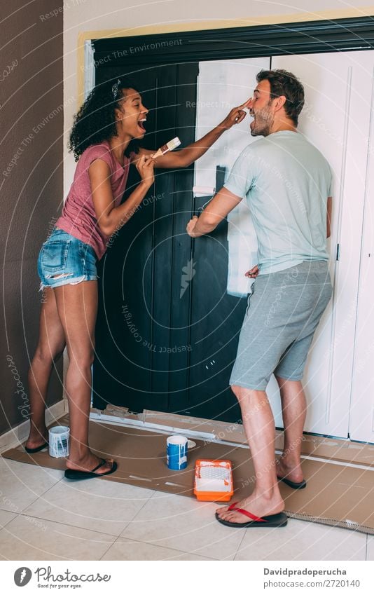 Interracial couple painting a wardrobe Painting (action, artwork) Relationship diy paint roller Paintbrush Design Cheerful Couple 2 Happy Love Home interracial
