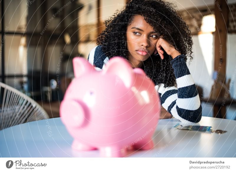 Sad frustrated black woman with piggy bank Woman Money box debt Crisis Sadness Budget Anger worried Financial Industry annoyed Stress Considerate Problem