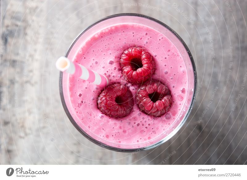 Raspberry smoothie in glass on wooden table.Top view Milkshake Beverage Drinking Food Healthy Eating Food photograph Vegan diet Red Glass Fruit antioxidant