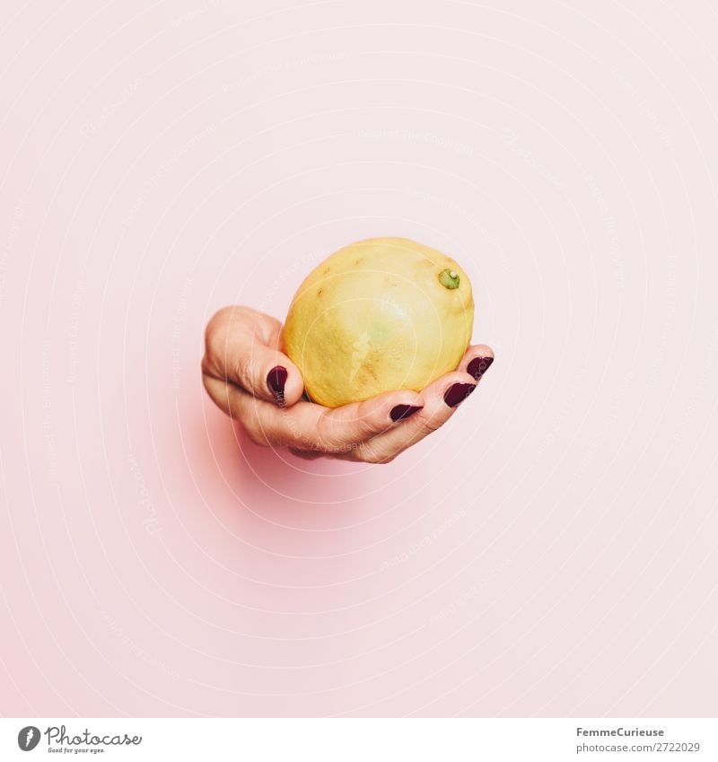 Hand of a woman with lemon in front of pink background Food Nutrition Breakfast Lunch Buffet Brunch Picnic Organic produce Vegetarian diet Feminine 1