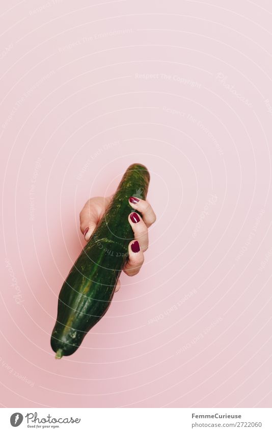 Hand of a woman holding a cucumber Food Nutrition Breakfast Lunch Dinner Picnic Organic produce Vegetarian diet Diet To enjoy Phallic symbol Penis Cucumber Pink
