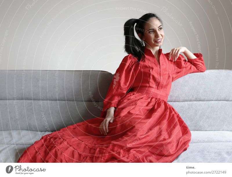 GizzyLovett Sofa Room Feminine Woman Adults 1 Human being Dress Brunette Long-haired Braids Observe Relaxation To enjoy Smiling Laughter Lie Looking