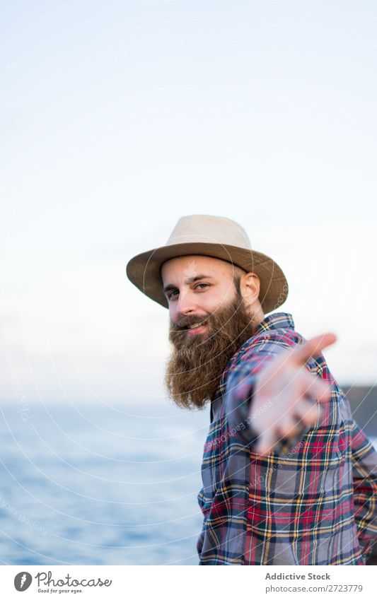 Man holding hands at seaside Tourist Nature bearded Hat Love follow me Gesture Ocean Vacation & Travel Adventure Azores Landscape Hiking Exterior shot