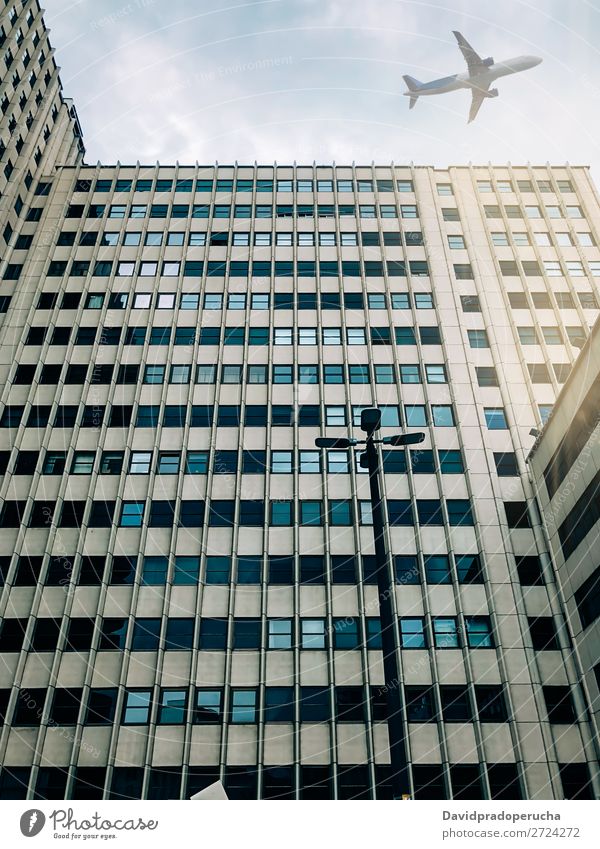 Plane flying over building Airplane Sky Aircraft Aviation Flying City Air Traffic Control Tower Airport from below Architecture Building Departure Landing Town