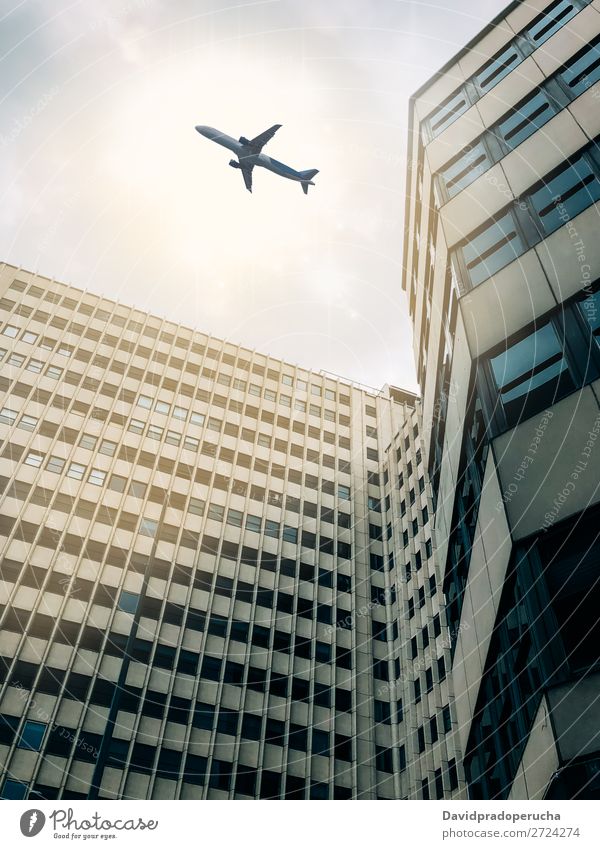 Plane flying over building Airplane Sky Aircraft Aviation Flying City Air Traffic Control Tower Airport from below Architecture Building Departure Landing Town