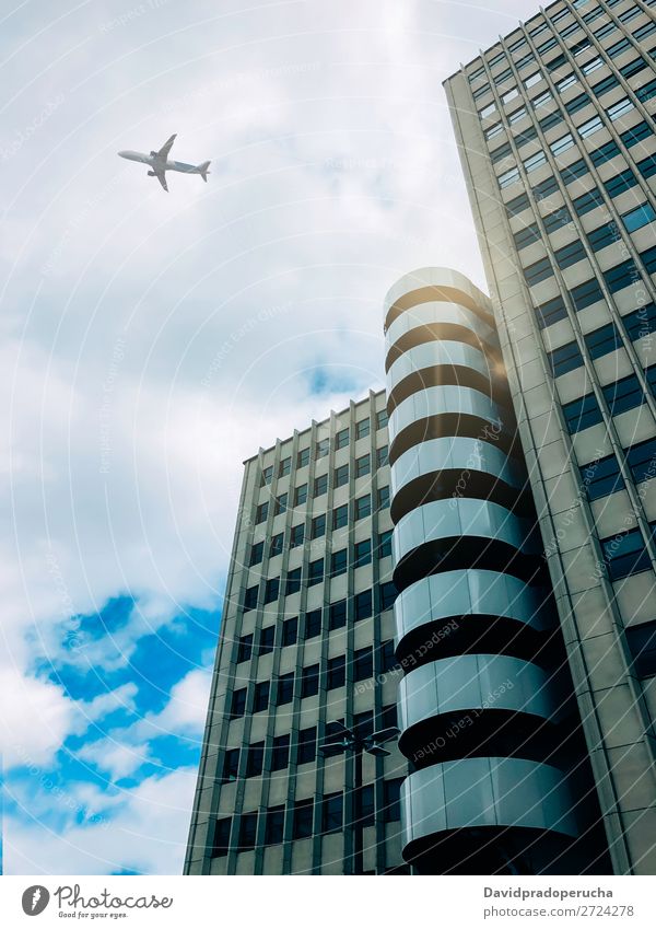 Plane flying over building Airplane Sky Aircraft Aviation Flying City Air Traffic Control Tower Airport from below Architecture Building Departure Landing Town