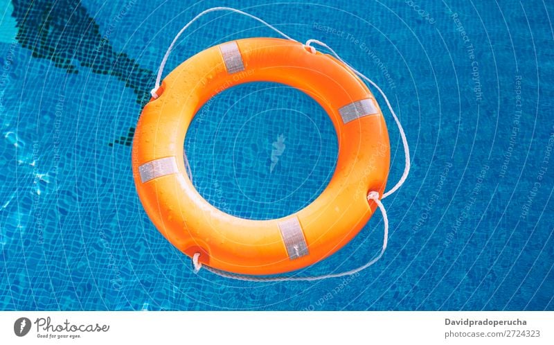 Lifesaver in the swimming pool lifesaver Swimming pool Lifebuoy Safety safe Float in the water Sunlight Help aid Buoy SOS Summer Emergency Safety (feeling of)