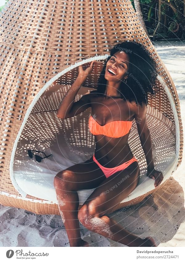 Woman in the Maldives island beach hammock African Ethnic Black Girl tan Vacation & Travel Beach Sand Summer Swimwear Beautiful Smiling Exotic Bikini Cheerful