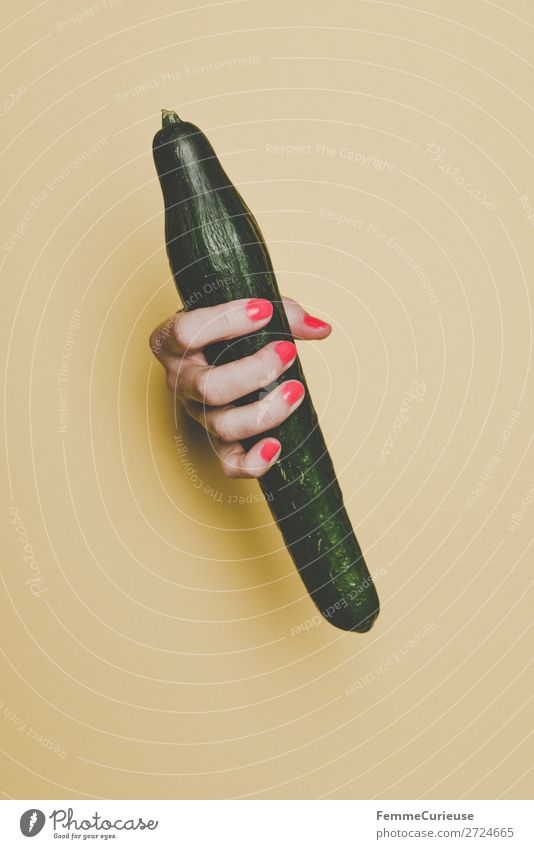 Hand of a woman holding a cucumber Feminine 1 Human being Esthetic Phallic symbol Penis Cucumber Fertile Vegetable Healthy Eating Nutrition Food Fingers