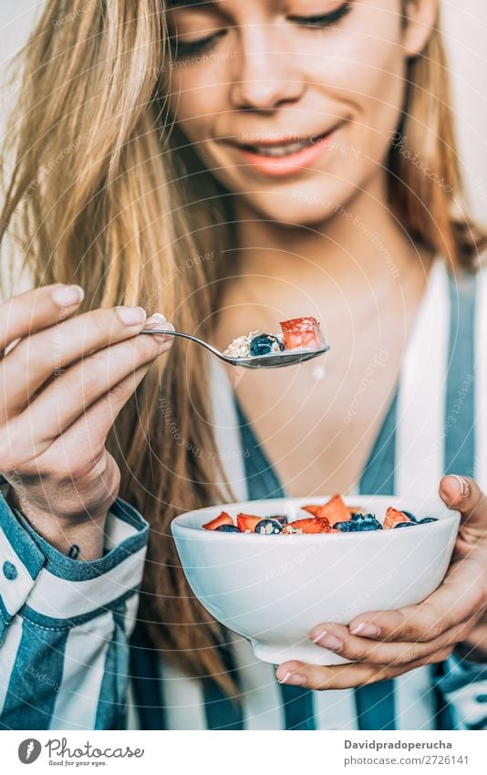 woman close up eating oat and fruits bowl for breakfast Bowl Breakfast Woman Cereal porridge Hand Crops Strawberry Blueberry Oats Healthy Food White Organic