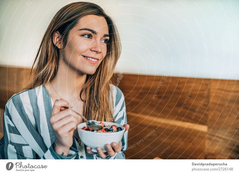 woman close up eating oat and fruits bowl for breakfast Beautiful Blueberry Bowl Breakfast Cereal Close-up Crops Dairy Delicious Dessert Diet To feed Eating