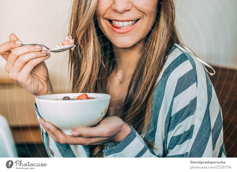 Crop woman close up eating oat and fruits bowl for breakfast Bowl Breakfast Woman Cereal porridge Hand Crops Anonymous Unrecognizable Strawberry Blueberry Oats