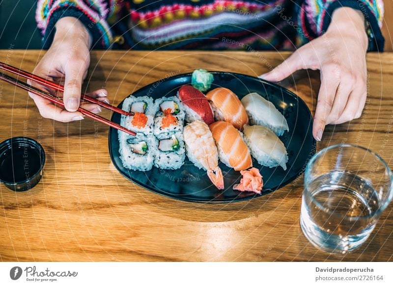 Sushi Set nigiri and sushi rolls on rectangular wooden plates