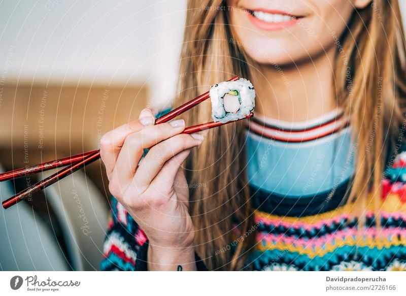 Crop woman eating sushi Sushi Woman Smiling Hand Food soy maki california roll Chopstick Roll Crops Unrecognizable Anonymous Close-up Portrait photograph Salmon