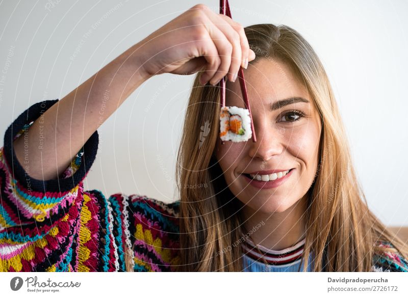 woman covering her eye with piece of sushi Sushi Woman Smiling Hand Food soy maki california roll Chopstick Roll Crops Unrecognizable Anonymous Close-up