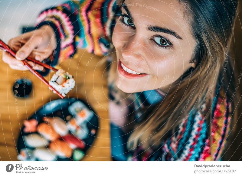 from above Crop woman eating sushi Sushi Woman Bird's-eye view Hand Food soy maki california roll Chopstick Roll Crops Unrecognizable Anonymous Close-up