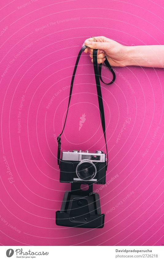 Hand holding a Vintage camera isolated at pink wall Arm Camera Pink Wall (building) Retro Old Isolated Studio shot Hold Leisure and hobbies Illustration Blank