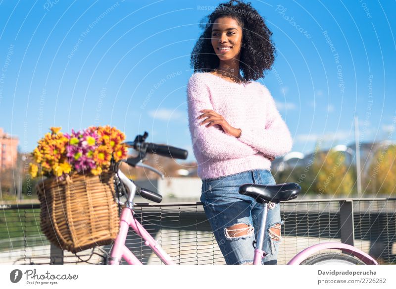 Black young woman riding a vintage bicycle Bicycle Girl Woman Vintage Ride Beautiful Retro Flower Sunbeam Happy Bouquet Summer Youth (Young adults) pretty