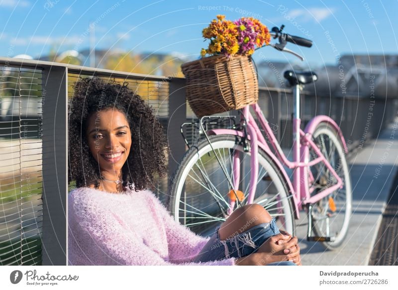 Black young woman sitting by the river with her vintage bicycle Bicycle Girl Beautiful Retro Flower Happy Vintage Bouquet Pink Summer Youth (Young adults) Woman