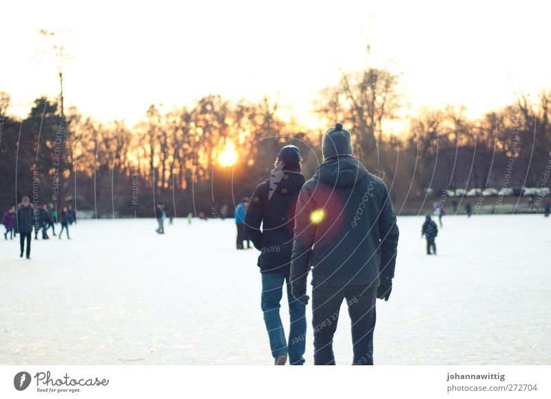 Ice wandering. Masculine Young man Youth (Young adults) Friendship Life 2 Human being Crowd of people 18 - 30 years Adults Environment Sun Sunrise Sunset Winter
